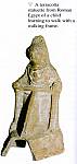 083. statuette en terre cuite dEgypte romaine representant un enfant apprenant a marcher avec un deambulateur.jpg